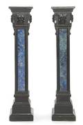 A Pair of Ebonized and Verre Eglomise Columns
