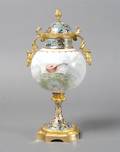 A Continental Porcelain GiltMetal and Champleve Mounted Urn and Cover
