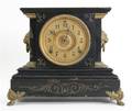 A Cast Metal Mantel Clock