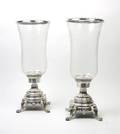 A Pair of Neoclassical Silvered Metal Candlesticks