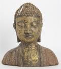 A Cast Iron and Parcel Gilt Model Bust of Buddha