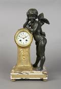 A French Gilt and Patinated Metal Figural Clock