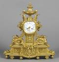 A Louis XVI Style Gilt and Bronze Mantle Clock