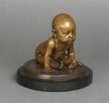 A Bronze Figure of a Baby