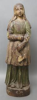 A Colonial Carved and Polychrome Decorated Figure