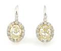 A Pair of Platinum Fancy Yellow and White Diamond Earrings