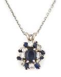A 14 Karat White Gold Diamond and Blue Sapphire Pendant