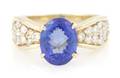 A 14 Karat Yellow Gold Diamond and Tanzanite Ring