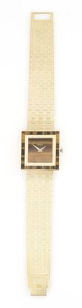 An 18 Karat Yellow Gold and Tigers Eye Wristwatch Piaget