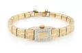 A 14 Karat Yellow Gold and Diamond Wristwatch Incabloc