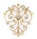 A 14 Karat Yellow Gold and Diamond Pin