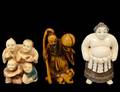 GROUP OF THREE CARVED IVORY NETSUKES