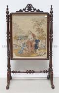 A Mahogany and Framed Needlepoint Firescreen