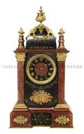 A Continental Gilt Bronze Mounted Marble Mantel Clock