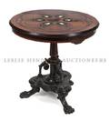 A Continental Marquetry Ebonized and Ivory Inlaid Center Table