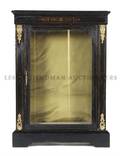 A Napoleon III Ebonized and Gilt Metal Mounted Cabinet