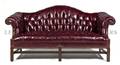 A Leather Upholstered Camelback Sofa
