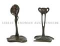 A Group of Two Art Nouveau Style Bronze Candleholders