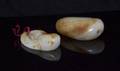 A Group of Two Pebble Form Jade Articles