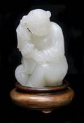 A Chinese White Jade Figural Toggle