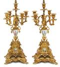 A Pair of Sevres Style Gilt Metal and Mounted FiveLight Candelabra
