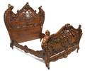 A Baroque Revival Carved Walnut Bed