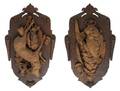 A Pair of Black Forest Style Carved Game Plaques