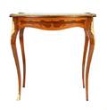A Louis XVI Style Marquetry and Gilt Metal Mounted Occasional Table