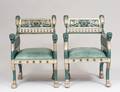 PAIR OF EGYPTIAN REVIVAL STYLE PARCEL GILT ARM CHAIRS