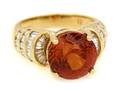 An 18 Karat Yellow Gold Spessartite Garnet and Diamond Ring