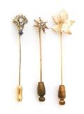 A Group of Three 14 Karat Gold Stick Pins