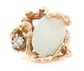 A 14 Karat Yellow Gold Opal and Diamond Ring