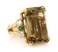 A 14 Karat Yellow Gold Citrine Diamond and Emerald Ring