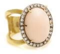 An 18 Karat Yellow Gold Coral and Diamond Ring