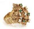 A 14 Karat Yellow Gold Emerald and Diamond Ring