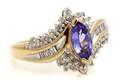 A 14 Karat Yellow Gold Tanzanite and Diamond Ring
