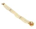 A Three Strand Pearl Bracelet with 14 Karat Yellow Gold Clasp
