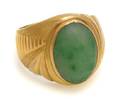 An 18 Karat Yellow Gold Dyed Green Stone Ring