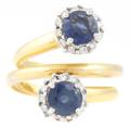 An 18 Karat Yellow Gold Blue Sapphire and Diamond Ring
