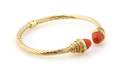 A 14 Karat Yellow Gold and Coral Hinged Bracelet