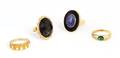 A Group of Four 14 Karat Yellow Gold and Gemstone Rings