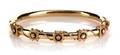 A 14 Karat Yellow Gold and Diamond Bangle Bracelet