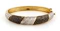A 14 Karat Two Tone Gold Black and White Diamond Bracelet