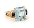 A 14 Karat Yellow Gold Aquamarine and Sapphire Ring