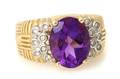 A 14 Karat Two Tone Gold Amethyst and Diamond Ring