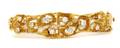 A 14 Karat Yellow Gold and Diamond Bangle Bracelet