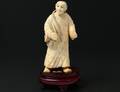 CARVED IVORY FIGURE