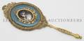 A Continental Enameled and Gilt Metal Hand Mirror