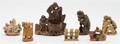 A Collection of Thirteen Soapstone or Wood Carvings