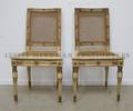 A Pair of Neoclassical Style Painted and Parcel Gilt Side Chairs